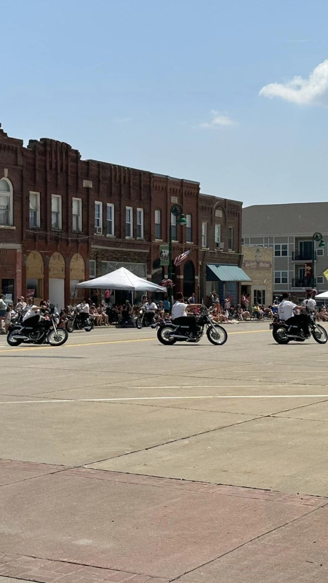 People riding bike & enjoying parade